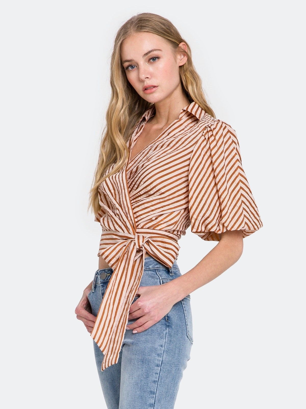 Model wearing the brown and white striped top