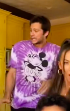 Dylan&#x27;s wearing a tie-dye shirt with Mickey Mouse on the front