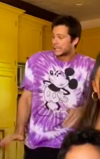 Dylan&#x27;s wearing a tie-dye shirt with Mickey Mouse on the front
