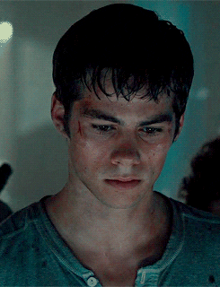 Dylan O&#x27;Brien in Maze Runner looking up seriously
