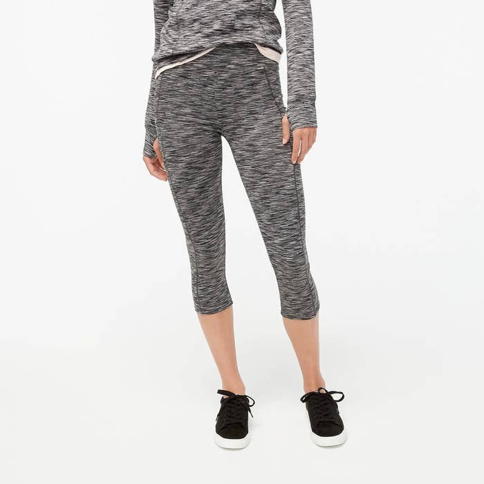 Model wearing the shadow black cropped space-dyed leggings with side pockets