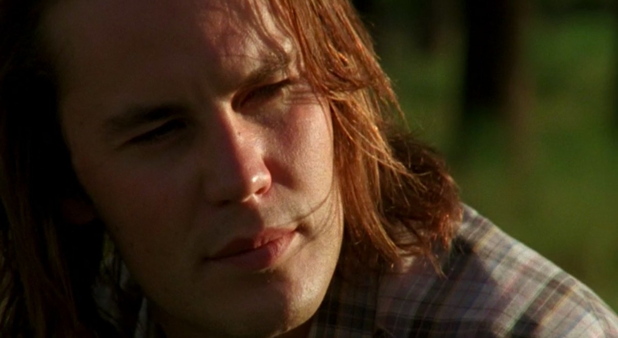 Close up of Tim Riggins as he sits in the sun