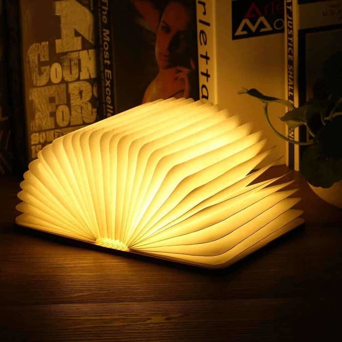 A book lamp with open pages on a table