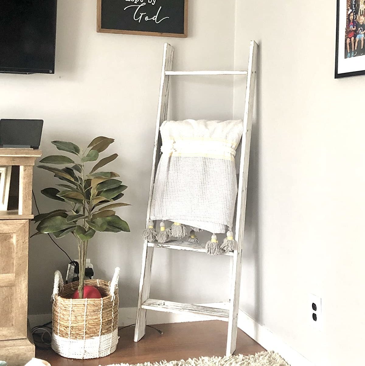 the ladder in white holding a blanket
