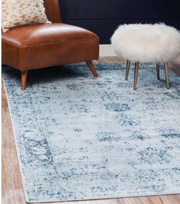 The light blue/navy abstract area rug