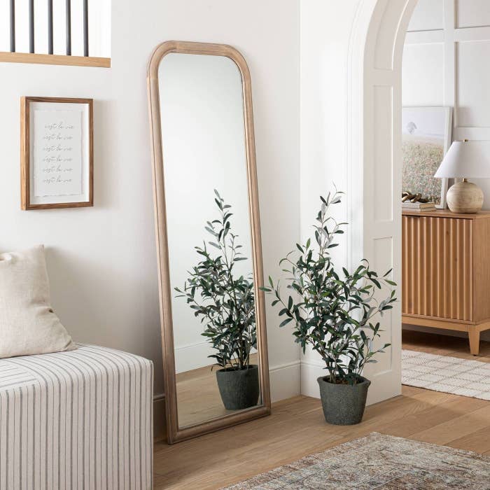 The natural wood floor mirror