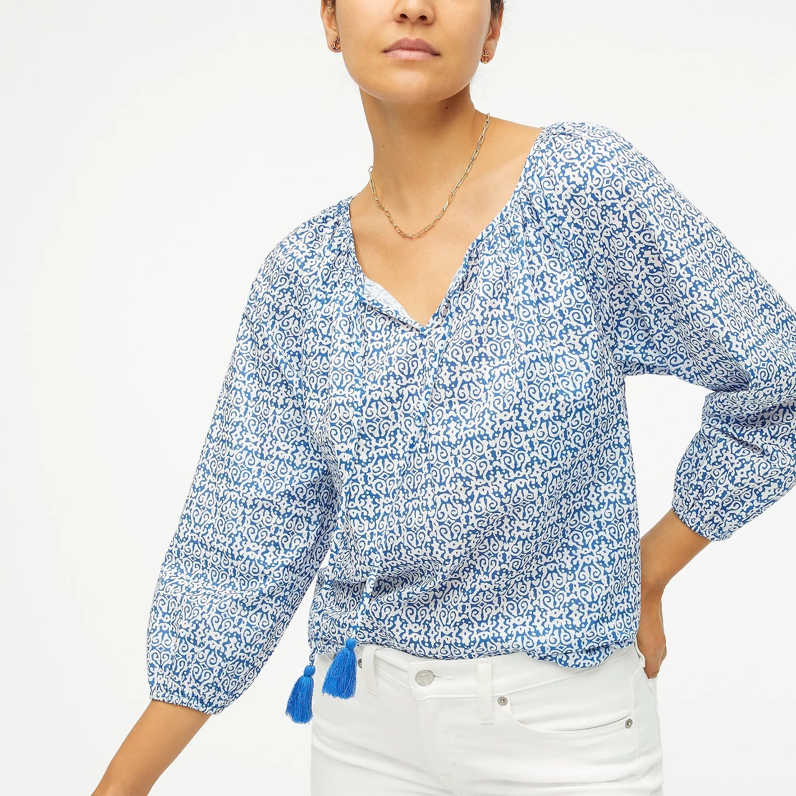 A model wearing the long sleeve blue and white top