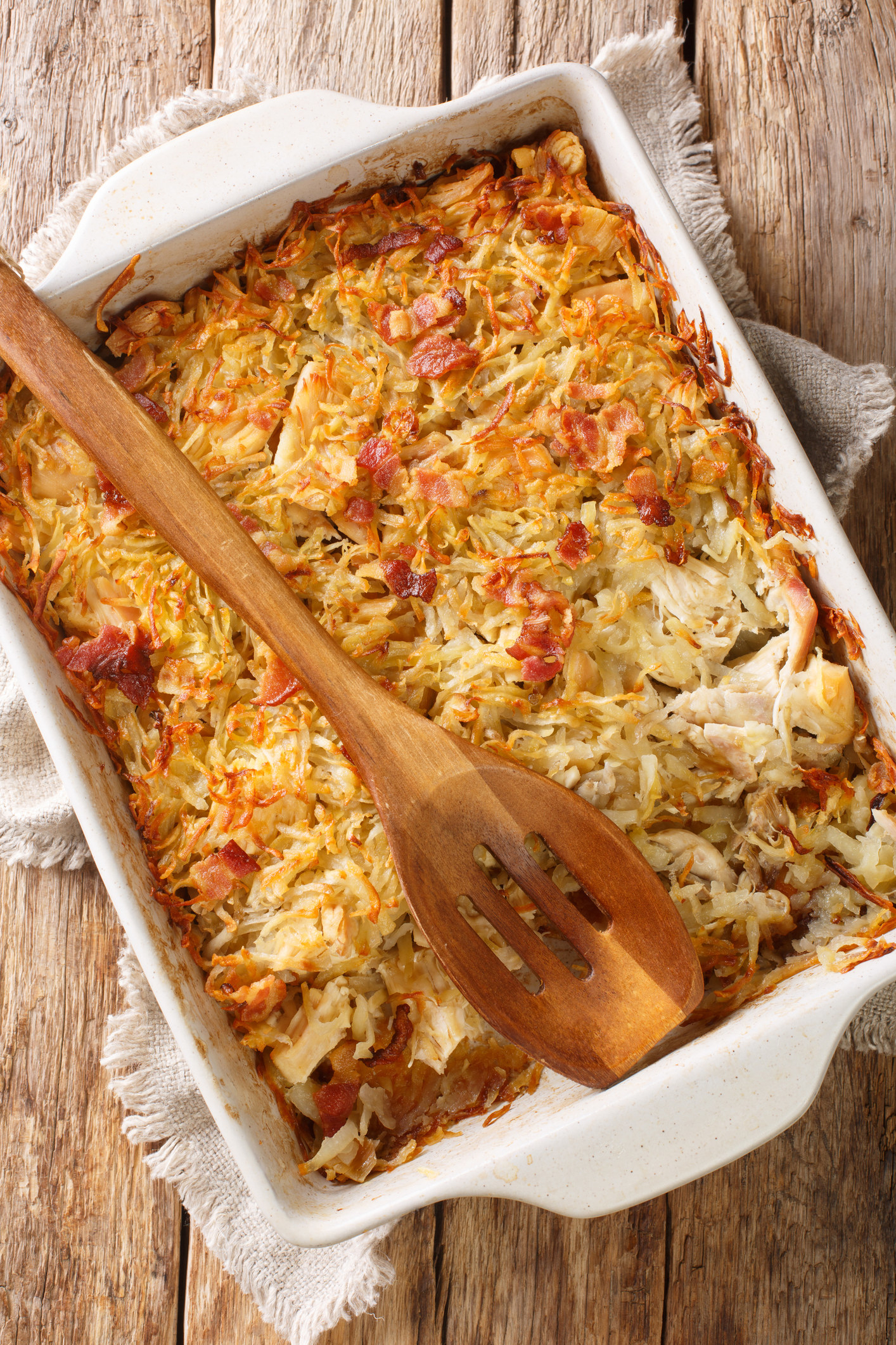 Photo of a cooked potato-chicken mix in a casserole dish.