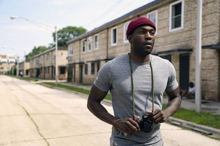 Yahya Abdul-Mateen II holding a camera