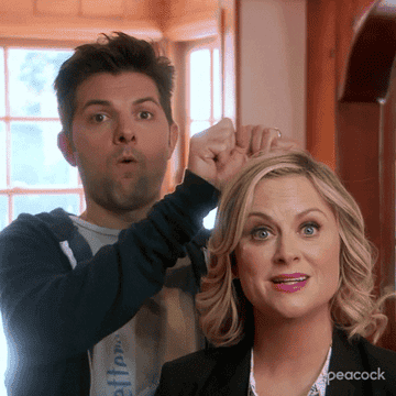 The Parks and Rec crew miming being mind blown