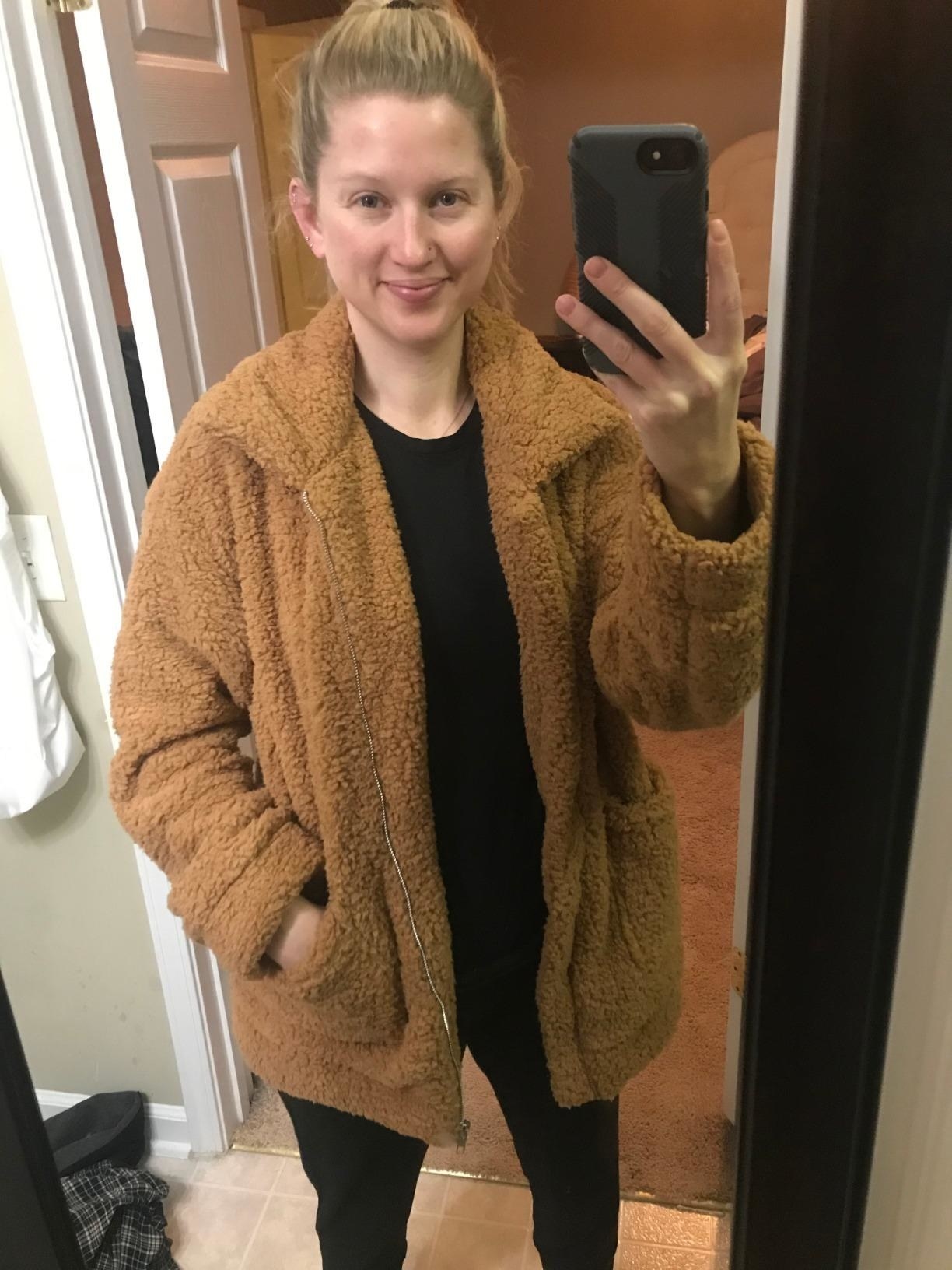 image of reviewer wearing the khaki prettygarden faux shearling jacket