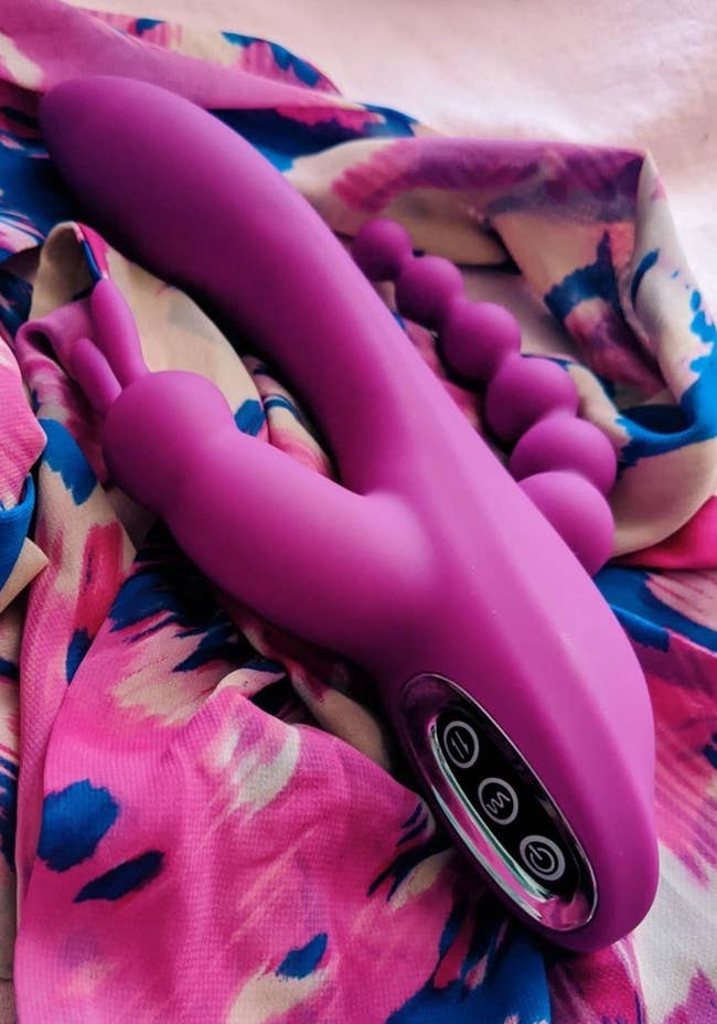 Pink triple-stimulating rabbit vibrator