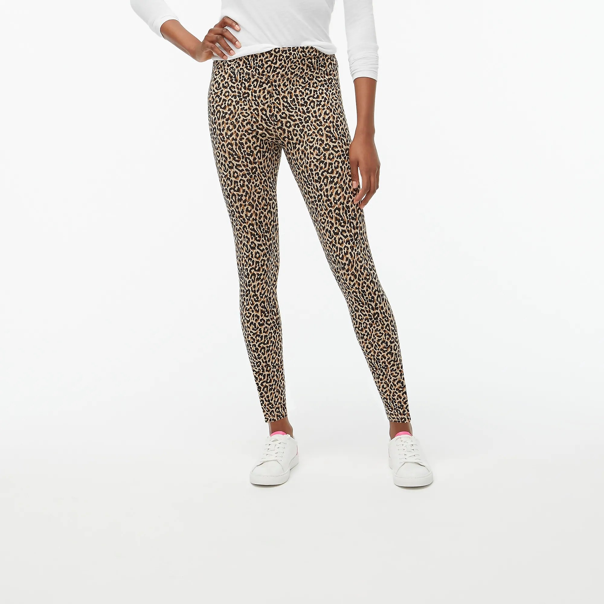 A model wearing the ankle-length leggings with a leopard print