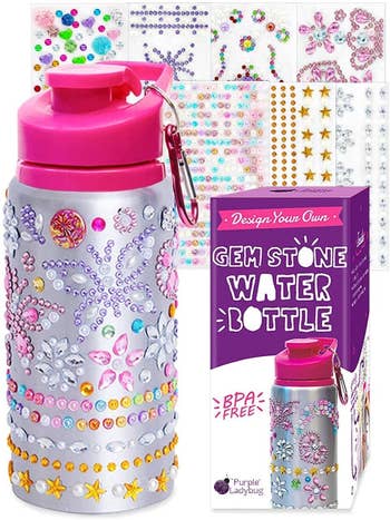 A water bottle decorated with rhinestone glitter gem stickers