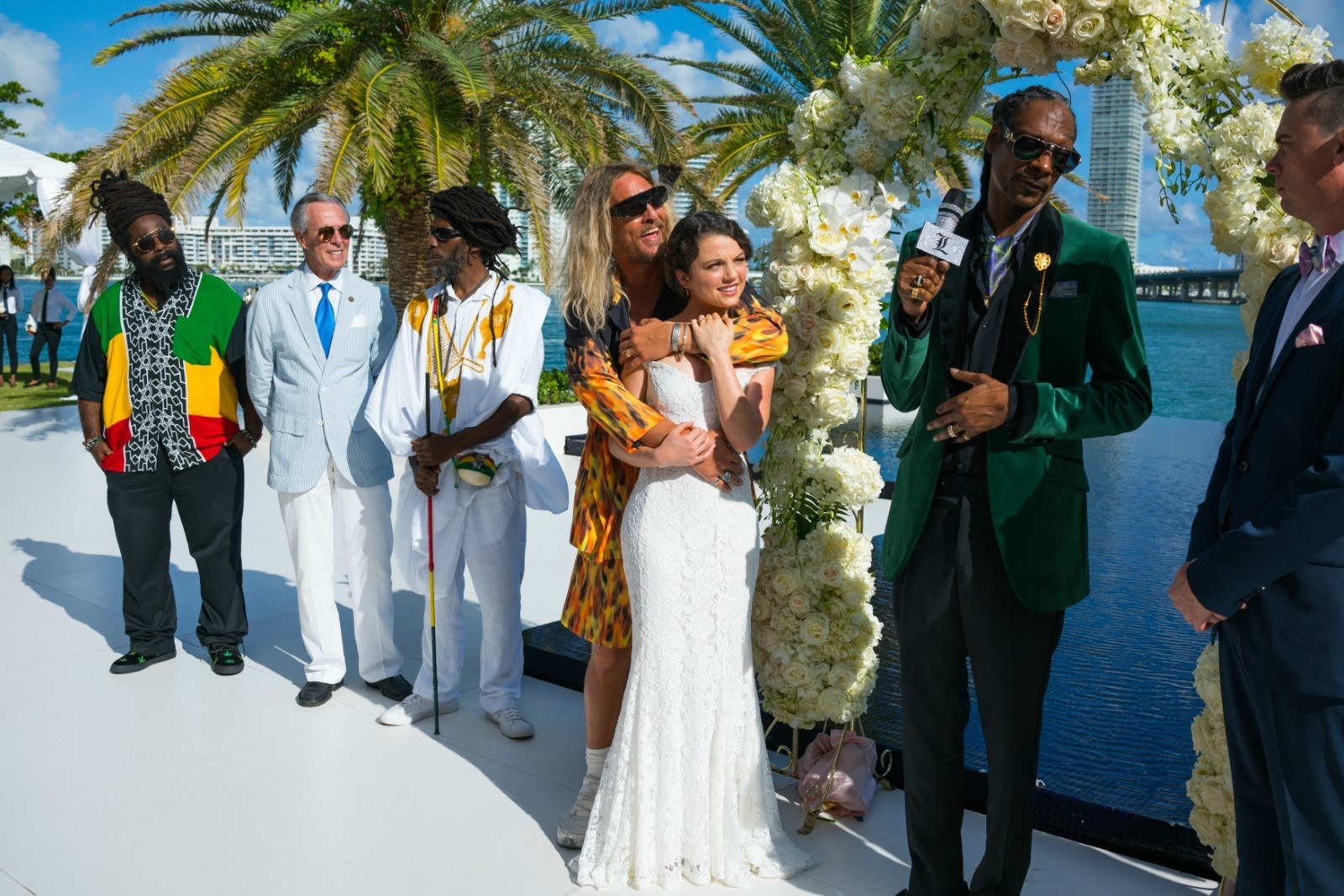 Matthew McConaughey hugs Stefania LaVie Owen as Snoop Dogg officiates her wedding