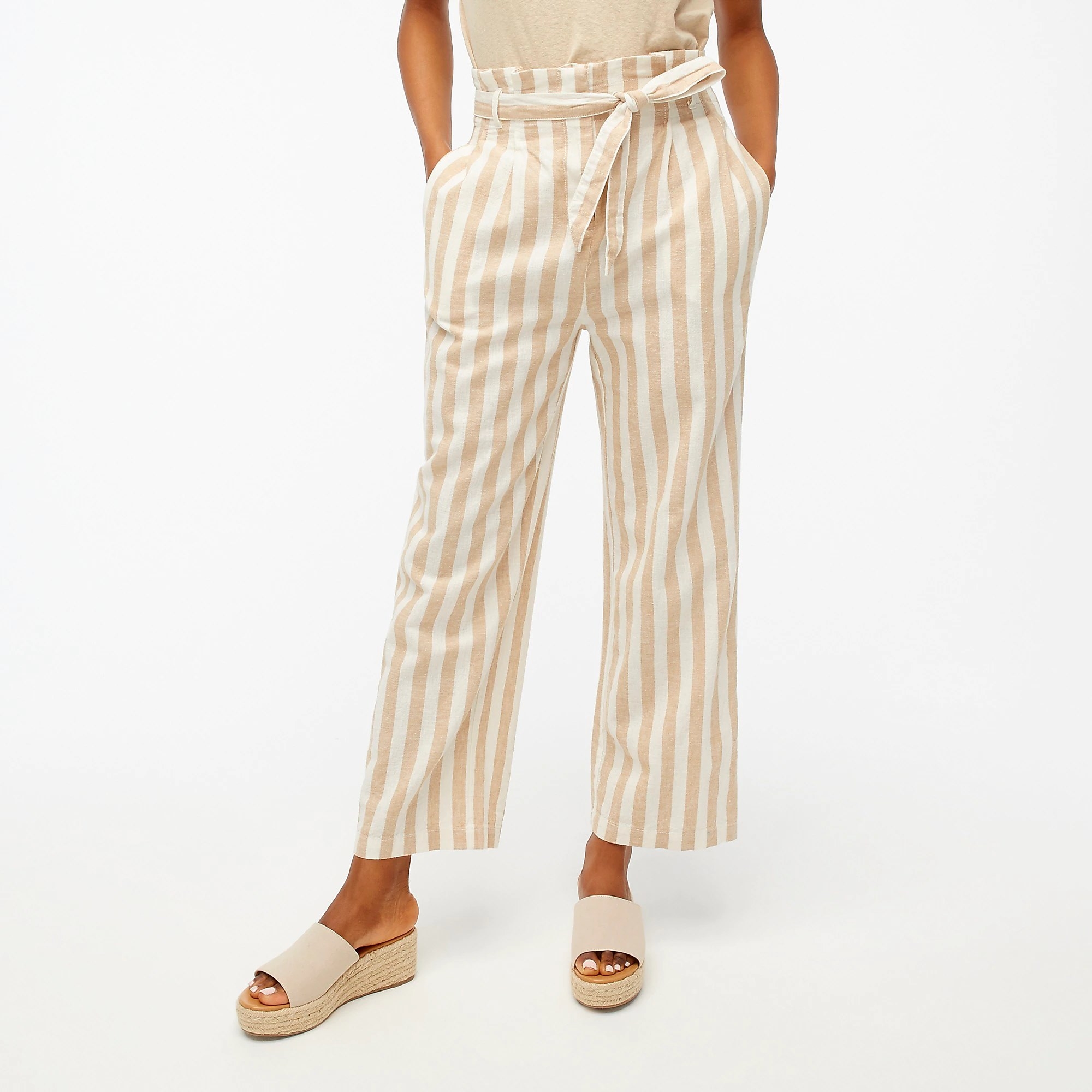 A model wearing the khaki and ivory striped pants