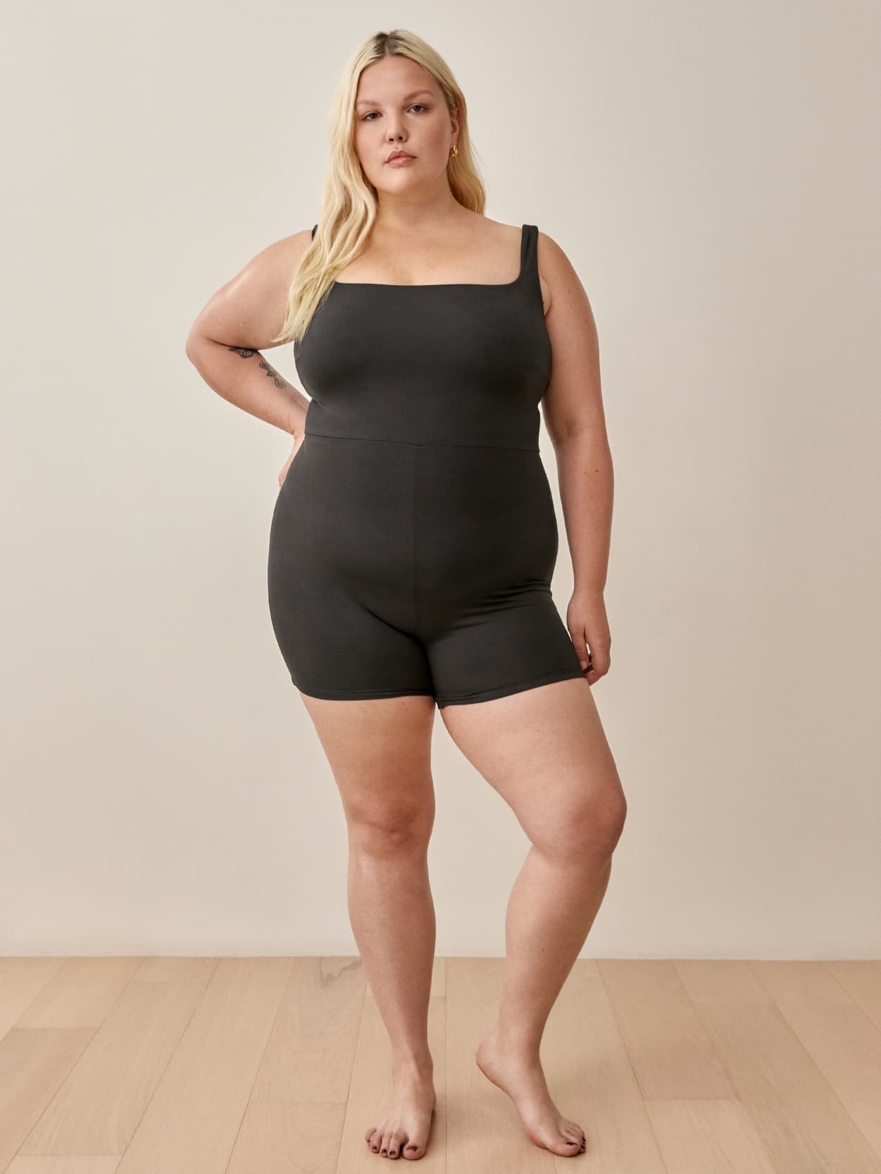 model wearing black jumpsuit