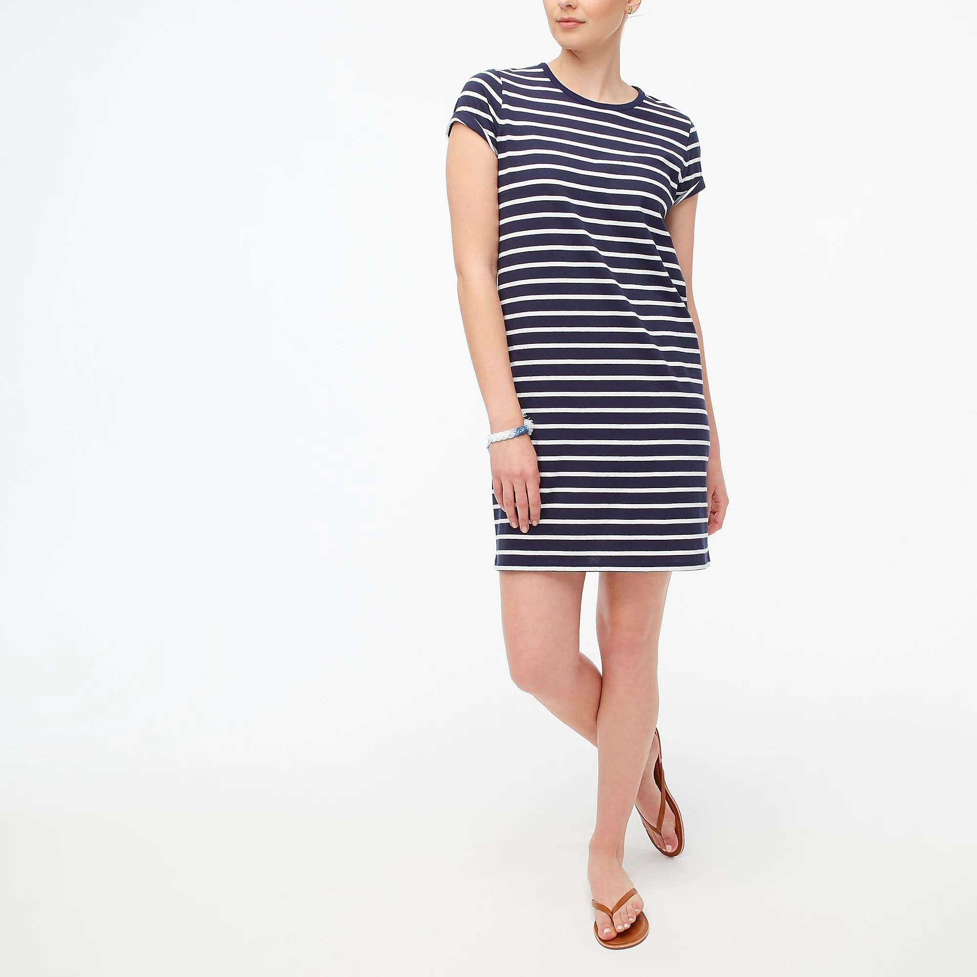 A model wearing the navy and white striped dress