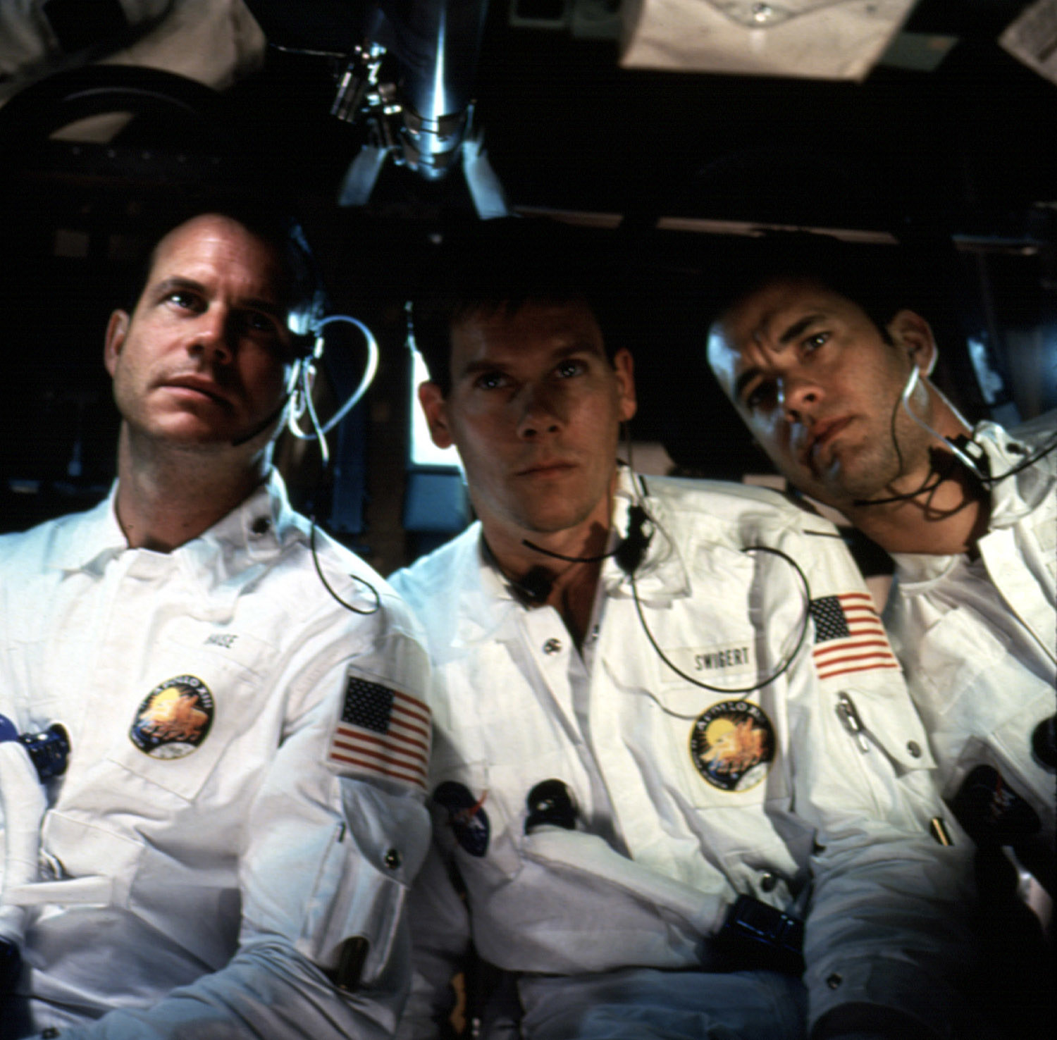 The three astronauts in their uniforms