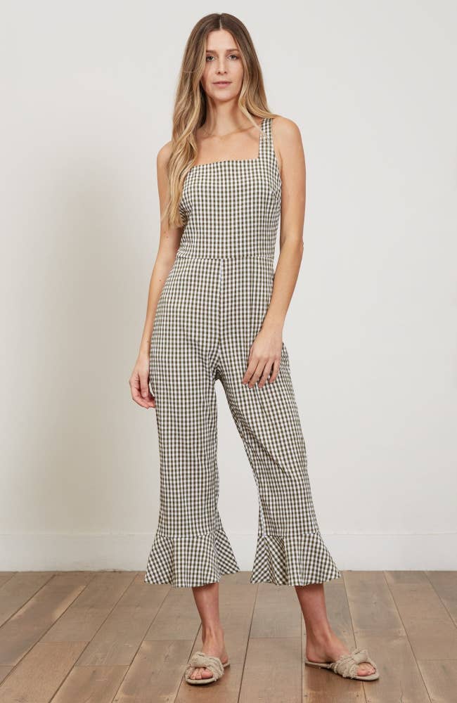 model wearing the cream and charcoal gingham jumpsuit