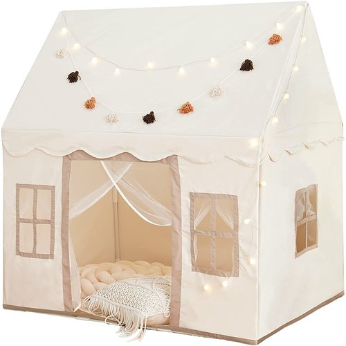 The cream play tent with mat, lights and tassels