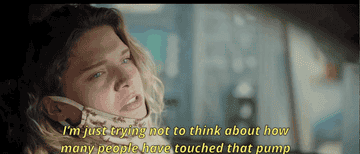 GIF of a woman talking in a car, with subtitle: I&#x27;m just trying not to think about how many people have touched that pump