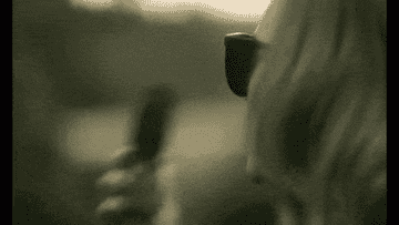 GIF close-up of Adele slamming phone