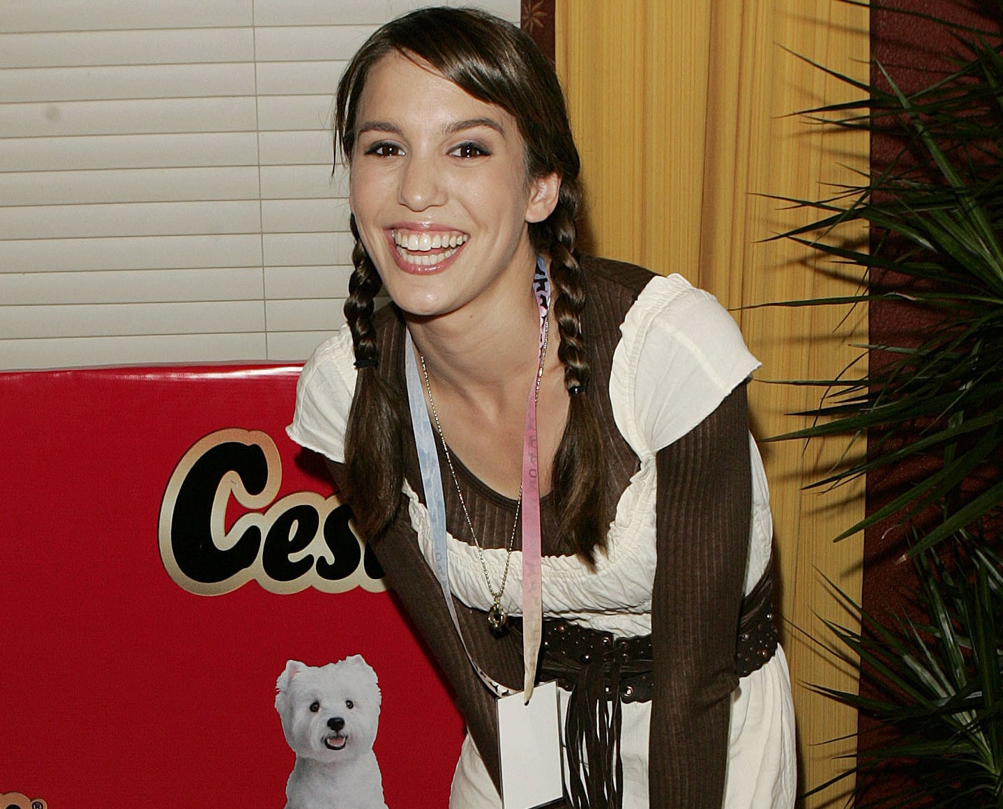 A young Christy wears her hair in braids and smiles