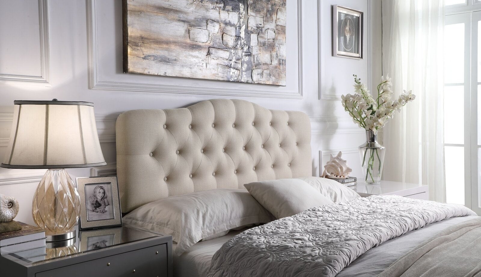 The light beige upholstered solid wood panel heardboard