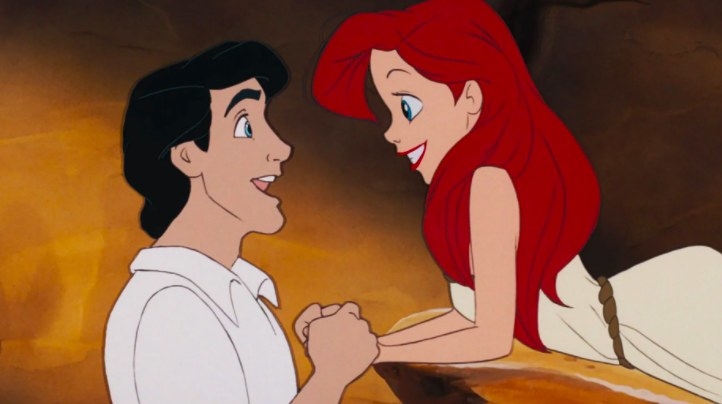 Eric graps Ariel&#x27;s hands as they look at  each other smiling