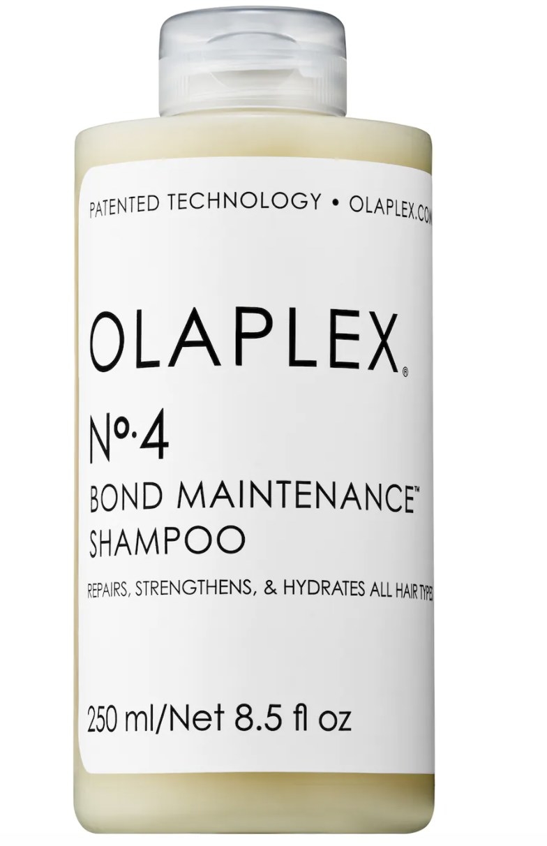 The clear bottle has a white label that says "OLAPLEX No. 4 BOND MAINTENANCE SHAMPOO" and is full of a cream-colored liquid