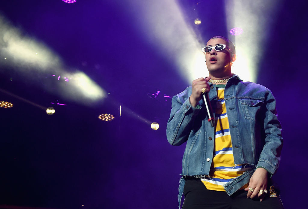 striped shirt, denim jacket, and gold chain