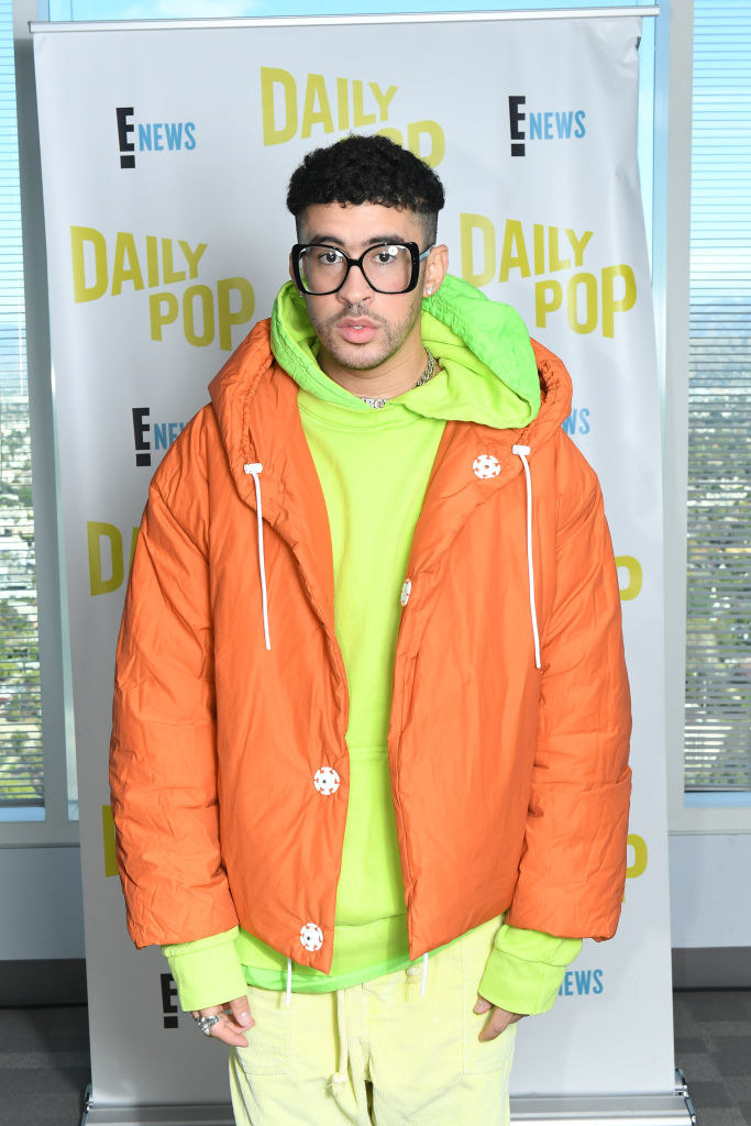 brightly colored puffer jacket, hoodie, and baggy pants