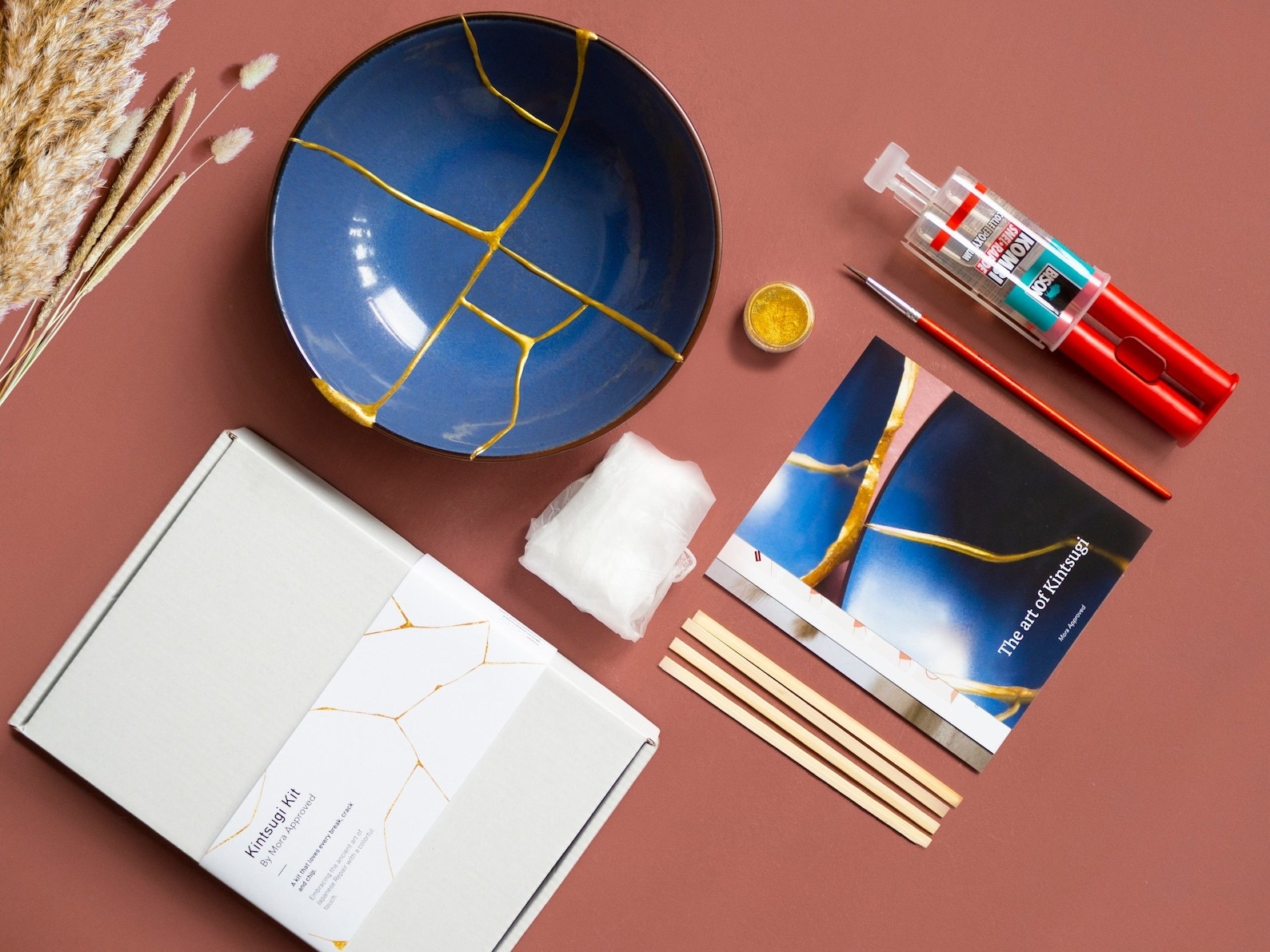 the kitsungi kit with paint, brushes, and other tools