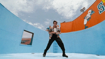 Jim Carrey as Ace Ventura looking into a camera