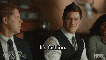 A person in a vest saying, &quot;It&#x27;s fashion&quot;