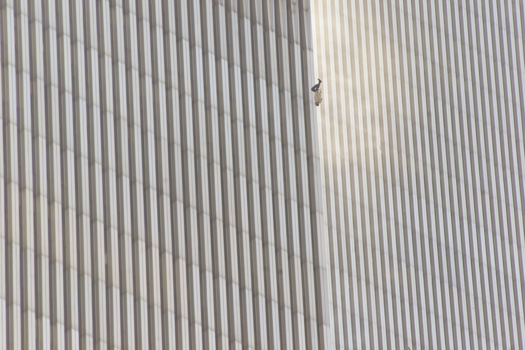 A man seen falling upside down against the walls of the World Trade Center