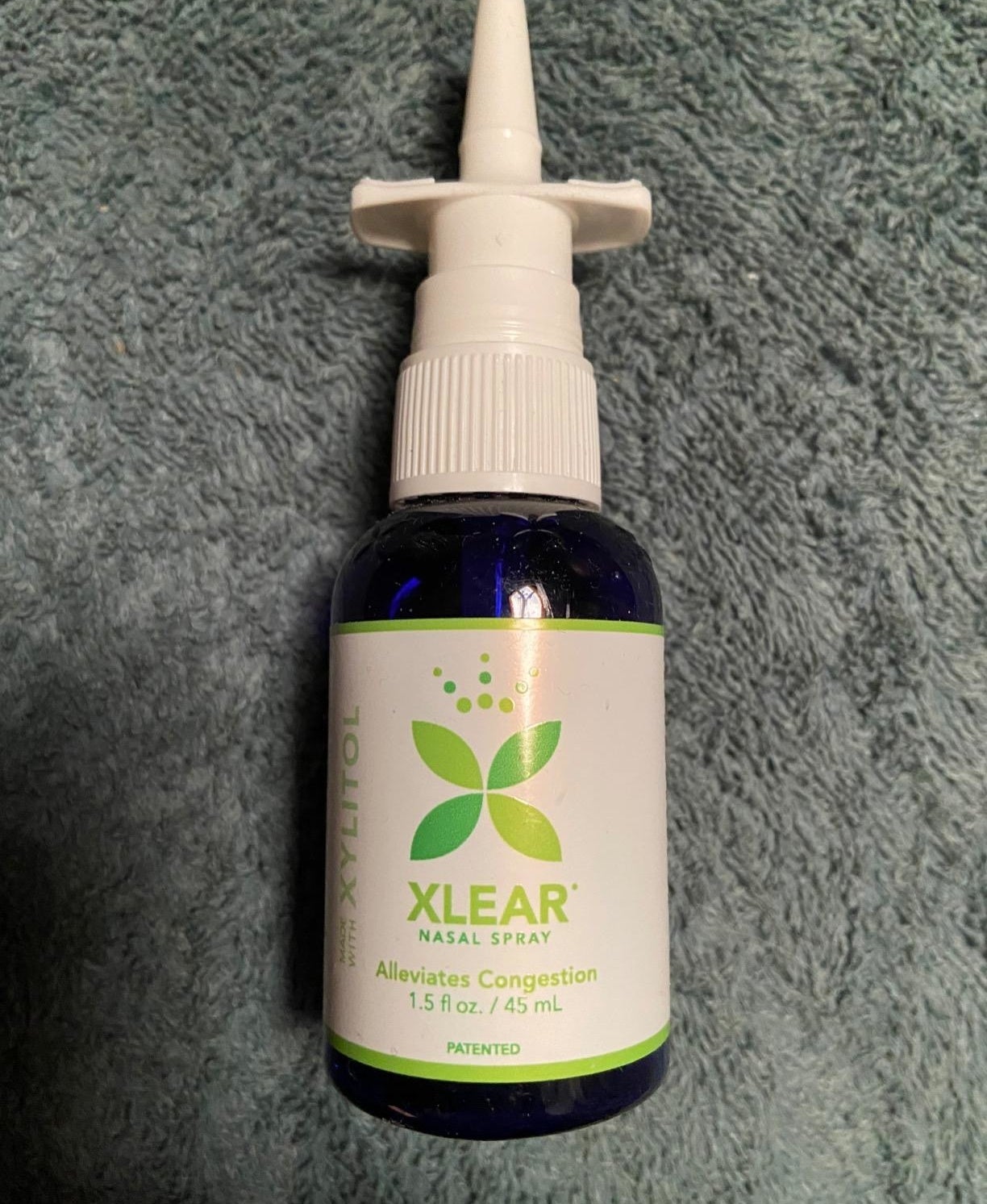 a reviewer photo of the nasal spray bottle