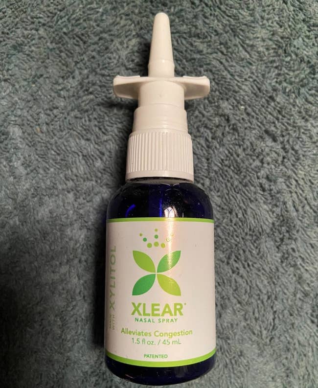 a reviewer photo of the nasal spray bottle