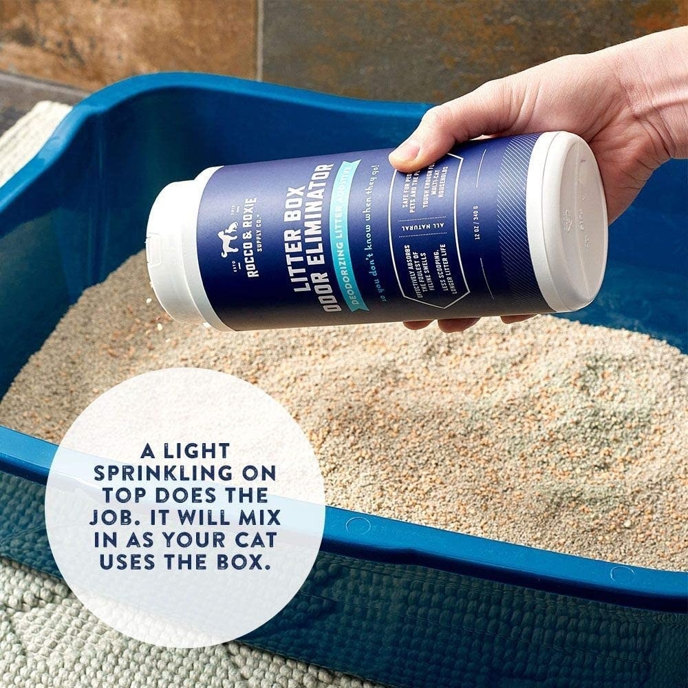 Hand sprinkling the product into a litter box