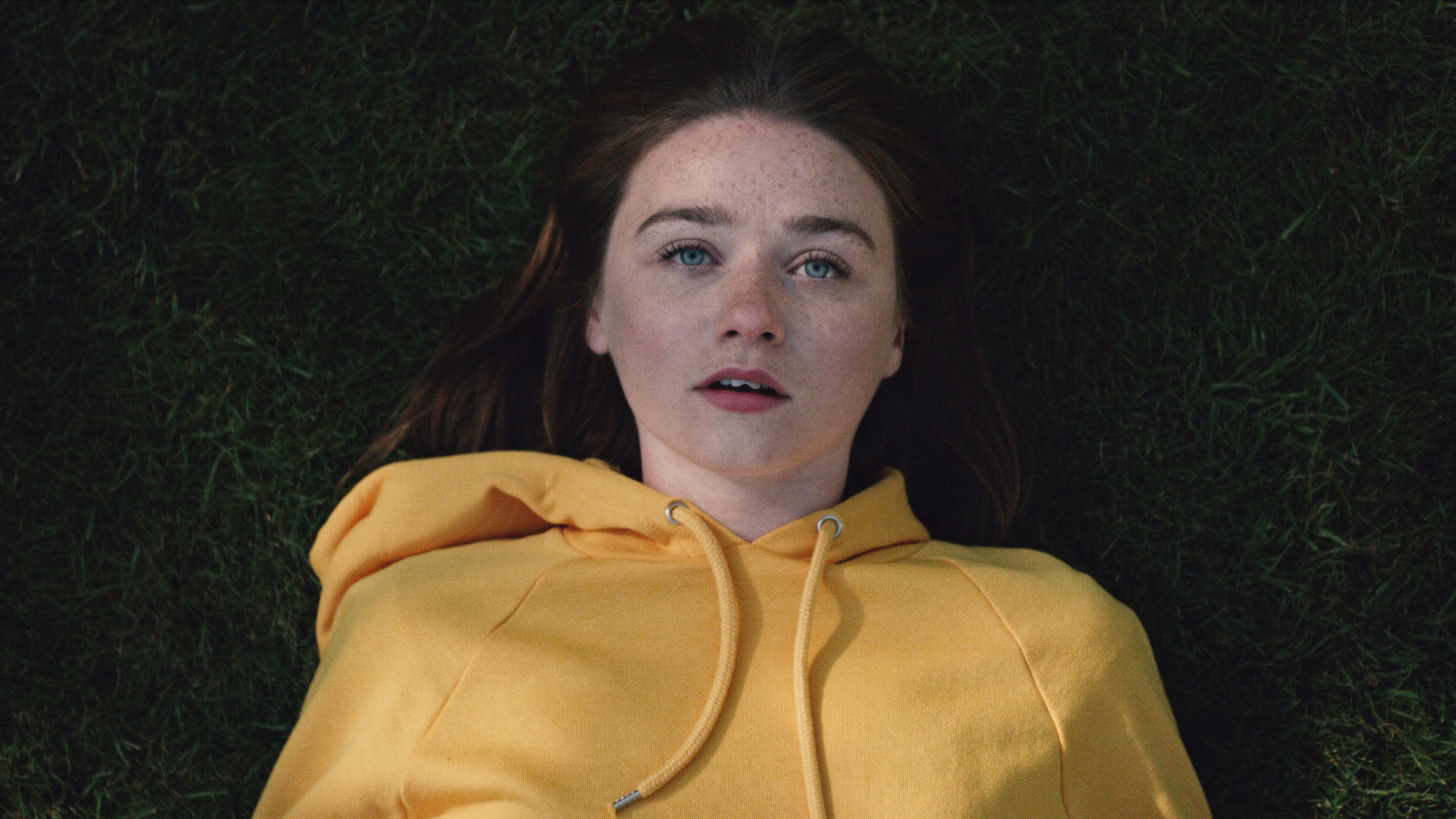 Jessica Barden laying in the grass on &quot;The End of the F***ing World&quot;