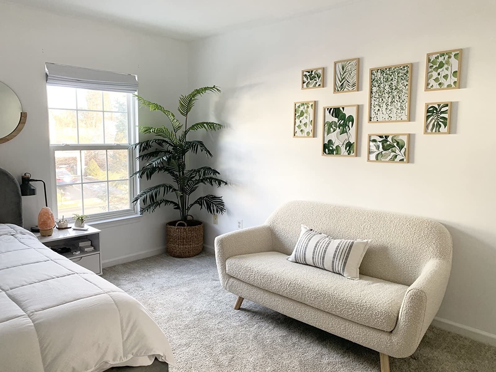 Reviewer&#x27;s bedroom shows the prints above a small sofa