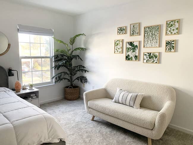 Reviewer's chamber  shows the prints supra  a tiny  sofa
