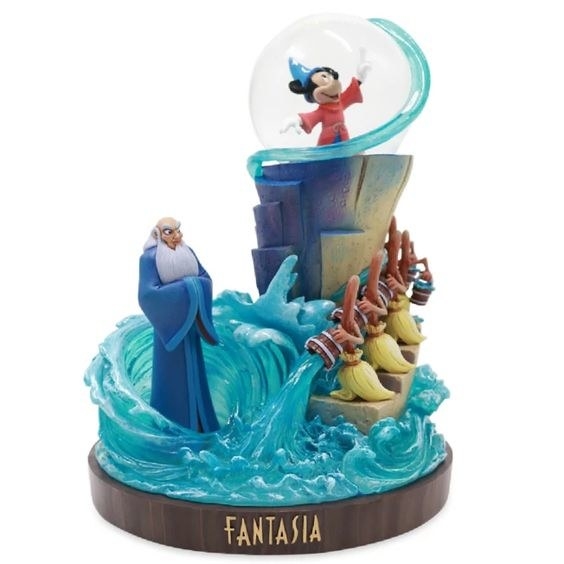 The figure showing Mickey Mouse enchanting the brooms from the snowglobe