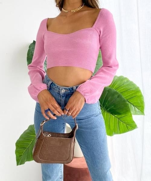 model wearing the pink sweater