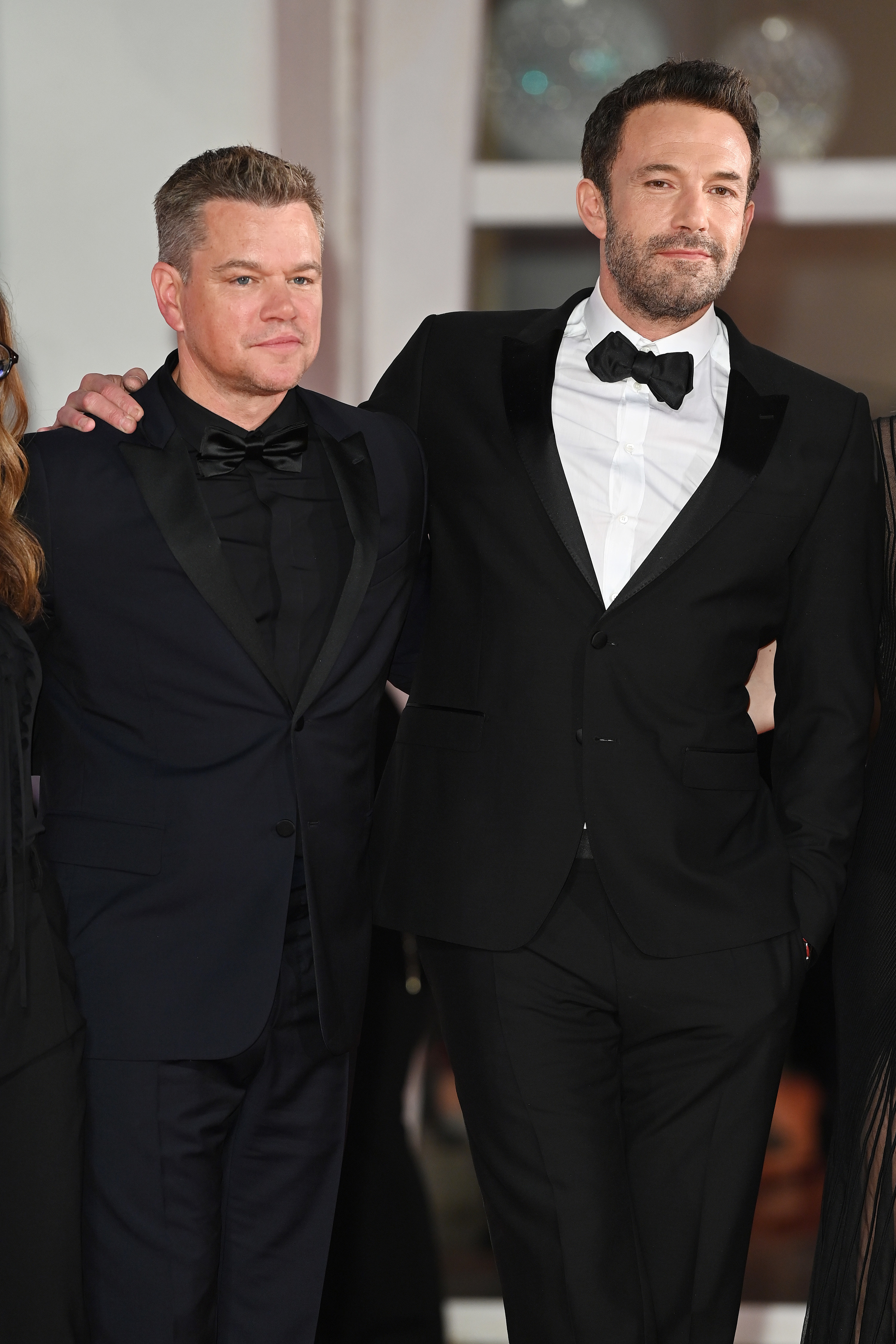 Matt and Ben in tuxedos at a red carpet event