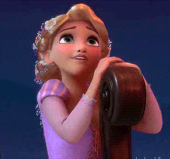 a gif of rapunzel from tangled looking wistful