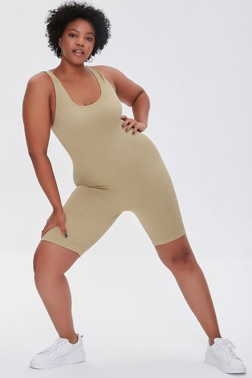 model wearing the beige colored unitard