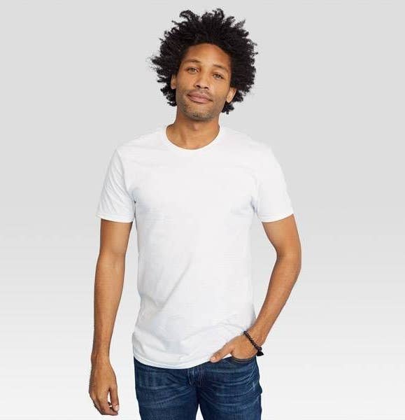 a model wearing the white crew neck T-shirt and jeans