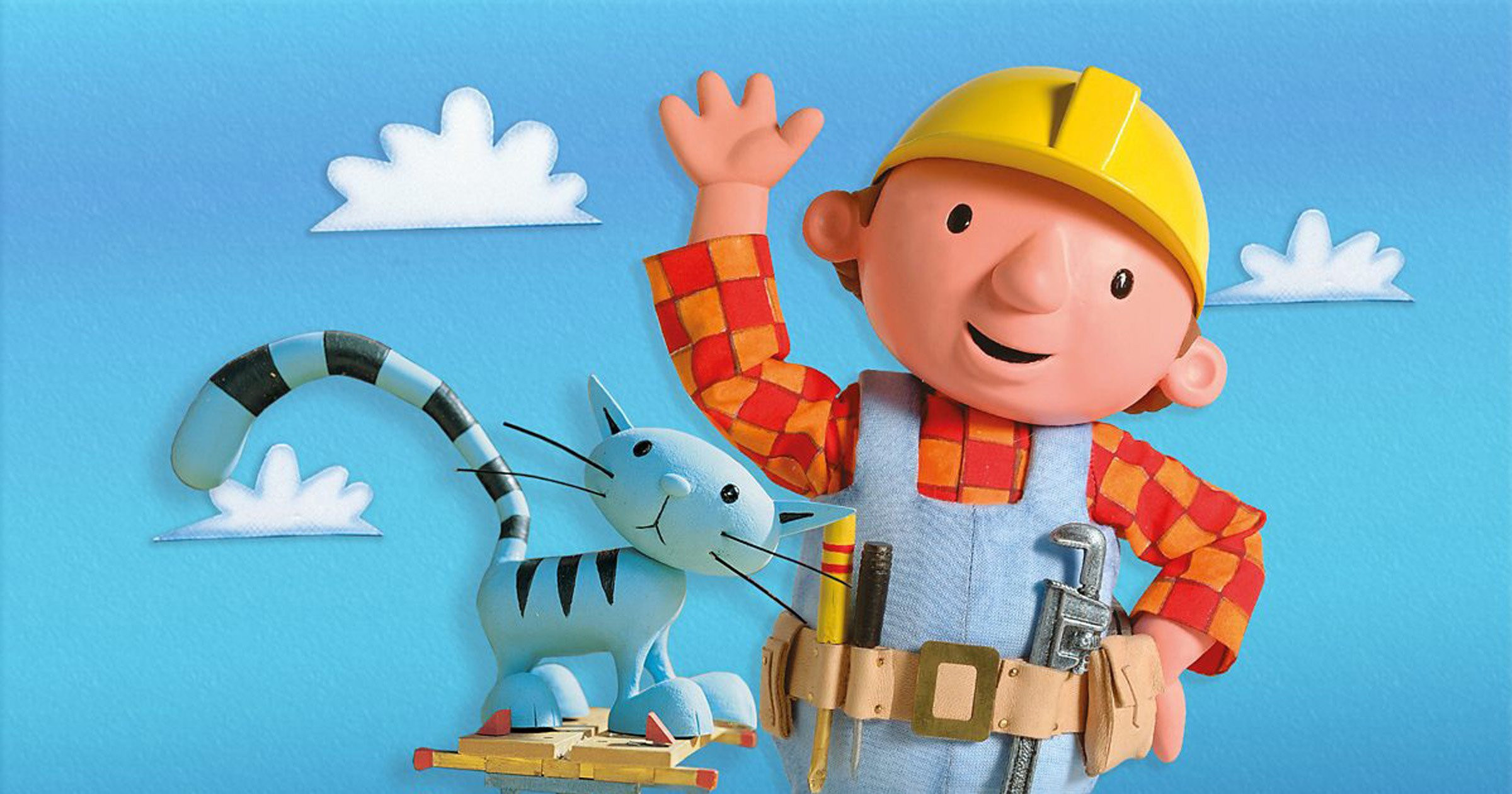 A picture of Bob the Builder (a fictional character) in his work gear along with his cat